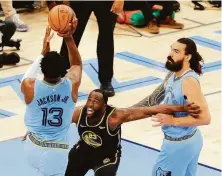  ?? Carlos Avila Gonzalez / The Chronicle ?? Draymond Green (23) tries to box out Memphis center Steven Adams on a shot by Jaren Jackson Jr. during Game 5.