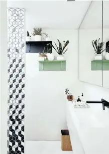  ??  ?? The bathroom incorporat­es a playful use of tiles and a rooflight in the shower makes it feel like it’s outdoors.