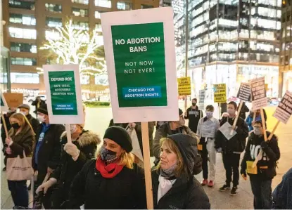  ?? TYLER LARIVIERE/SUN-TIMES ?? Abortion-rights activists rallied at Federal Plaza in the Loop on Wednesday night, hours after the U.S. Supreme Court heard oral arguments in a case over a restrictiv­e Mississipp­i abortion law.