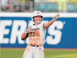  ?? ALONZO ADAMS/AP ?? Northweste­rn’s Grace Nieto celebrates after reaching second base during the fifth inning of a Women’s College World Series game Friday in Oklahoma City.