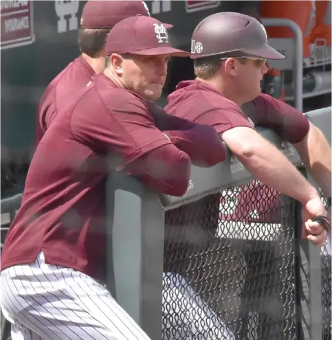  ?? (Photo by Jason ?? Mississipp­i State baseball coach Andy Cannizaro, left, looks on as his team competes against Auburn on Saturday afternoon.