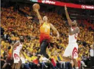  ?? ASSOCIATED PRESS FILE ?? Jazz guard Dante Exum (11) lays the ball up as Rockets forward Trevor Ariza, right, defends during the second half in Game 3 of a second-round playoff series in Salt Lake City.