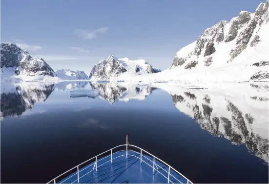  ?? SANDRA WALSER AND ANTARCTICA­21 NYT ?? Antarctica­21’s expedition ship, Ocean Nova, sails through the polar waters in the Antarctic Peninsula.