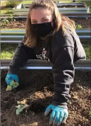  ??  ?? Daniel Boone Girl Scouts Olivia Darrohn and Giana Stoltzfus along with the members of their team, establishe­d the Garden of Hope located on the grounds of St. Gabriel’s Church in Douglassvi­lle.