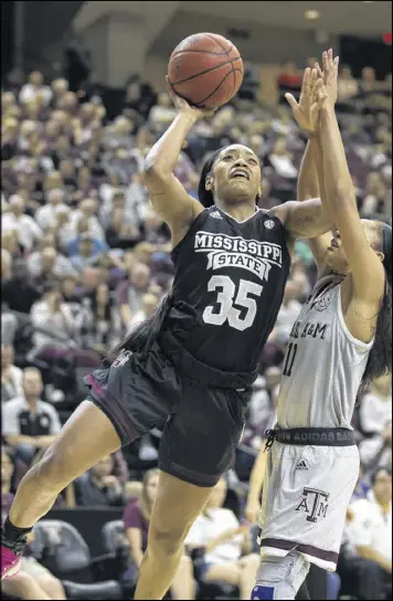  ?? SAM CRAFT / ASSOCIATED PRESS ?? Mississipp­i State’s Victoria Vivians shoots over Texas A&M’s Curtyce Knox during the No. 3 Bulldogs’ victory over the No. 23 Aggies on Sunday. Vivians had 25 points in the SEC showdown.