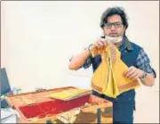  ?? SOURCED ?? Fashion designer Manish Tripathi with the yellow khadi silk garment for Ramlalla idol.