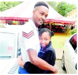  ?? PHOTOS BY CARL GILCHRIST ?? Happy to see her dad, Marlon Scarlett, turn up at school, grade six student Jordanique Scarlett greets him with a hug.