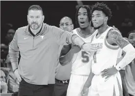  ?? John Minchillo/associated Press ?? Former Texas men’s basketball coach Chris Beard, left, was fired early in the second season of a seven-year contract.