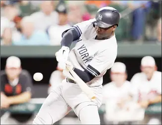  ??  ?? New York Yankees’ Didi Gregorius flies out against Baltimore Orioles starting pitcher Asher Wojciechow­ski during
the first inning of a baseball game on Aug 6 in Baltimore. (AP)