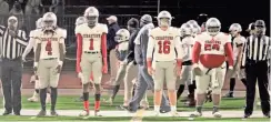  ?? / Contribute­d by Gail Conner ?? Tony Mathis takes a handoff in the backfield at St. Pius. Cedartown’s captains lined up for the final time at St. Pius to head to center field for the coin toss.