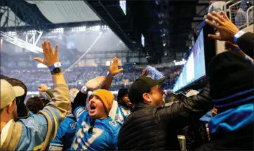  ?? PHOTOS BY EMILY ELCONIN — THE WASHINGTON POST ?? Fans cheered as the Lions scored the first touchdown of the game vs. the Rams. The home team came away with the victory.