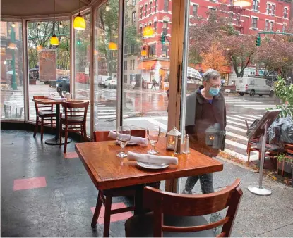  ?? GETTY IMAGES FILE ?? Remember going out to a restaurant and actually sitting down and eating inside? Mark Brown does, and he misses that.