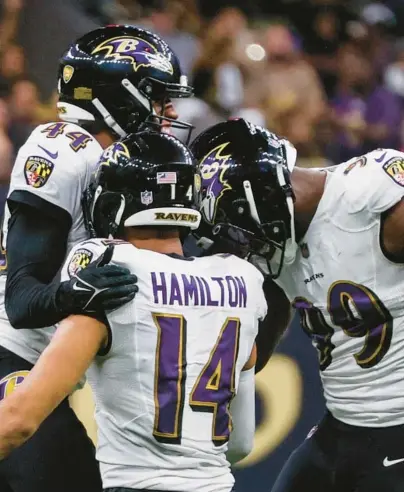  ?? BUTCH DILL/AP ?? Ravens cornerback Marlon Humphrey, left, safety Kyle Hamilton and outside linebacker Odafe Oweh celebrate after sacking Saints quarterbac­k Andy Dalton in the second half of Monday night’s game.