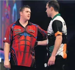  ??  ?? Top man: Daryl Gurney is congratula­ted by opponent William O’connor