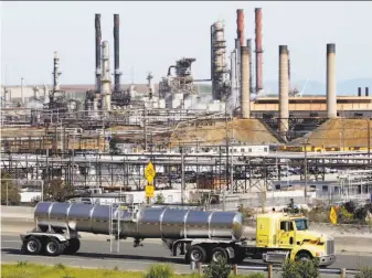  ?? Paul Sakuma / Associated Press ?? The Chevron refinery in Richmond. Chevron is one defendant in lawsuits filed by Marin and San Mateo counties and Imperial Beach (San Diego County) over the effects of climate change.