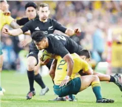  ?? AFP ?? Julian Savea of New Zealand is tackled by Nick Phipps of Australia in their Bledisloe Cup match in Sydney last Saturday.