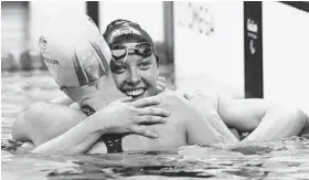  ?? LEO CORREA/ASSOCIATED PRESS ?? Baltimorea­n Jessica Long, facing camera, embraces Lakeisha Patterson of Australia after finishing second in the women’s S8 400-meter freestyle in Rio de Janeiro.