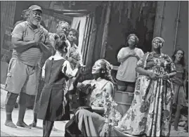  ?? JOAN MARCUS ?? MiMi Crossland (as Little Girl), Courtnee Carter (as Ti Moune) and the company of “Once on This Island.”