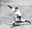  ??  ?? New York Yankees’ Don Larsen fires a strike against the Brooklyn Dodgers, in the fourth inning of Game 5 of the World Series en route to a perfect game, in New York, 62 years ago Monday.