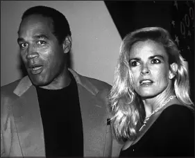  ?? PAUL HURSCHMANN / ASSOCIATED PRESS FILE (1993) ?? Former football star O.J. Simpson and his wife, Nicole Brown Simpson, are pictured in 1993 at the opening of the Harley-davidson Cafe in New York. A year later, Brown Simpson was dead and Simpson stood accused as her killer. In the “trial of the century,” Simpson was acquitted of his ex-wife’s murder but later went to prison in Nevada for burglary and robbery. He was released from prison in 2017 and lived in Las Vegas until his death April 10.