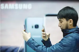  ?? Picture: Reuters ?? WISHLIST. A man takes photograph­s of a Samsung Electronic­s’ Galaxy S8 smartphone at a shop in Seoul, South Korea.