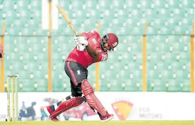  ?? COURTESY OF BPLT20.COM ?? West Indies and Fortune Barishal’s Kyle Mayers swings to leg during a Bangladesh Premier League Twenty20 game against the Sylhet Strikers at the ZAC Stadium in Chattogram yesterday.