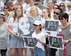  ??  ?? MARCH: Crowd pays tribute to Grace Millane in Auckland yesterday