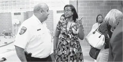  ?? BALTIMORE SUN ?? Baltimore City Police Commission­er Michael Harrison and Schools CEO Dr. Sonja Santelises chat during a tour at Vivien T. Thomas Medical Arts Academy on the first day of the school year.