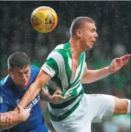  ?? REUTERS ?? Celtic defender Jozo Simunovic is first to a high ball during his team’s 4-0 Champions League qualifying, second-leg win over Linfield. The Glaswegian side won 6-0 on aggregate.