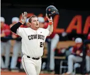  ?? BRYAN TERRY, THE OKLAHOMAN]
[PHOTO BY ?? Oklahoma State slugger Colin Simpson hit two of the Cowboys’ four home runs on Sunday. But OSU lost a 9-8 decision to West Virginia at Allie P. Reynolds Stadium.