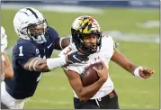  ?? BARRY REEGER — THE ASSOCIATED PRESS ?? Maryland quarterbac­k Taulia Tagovailoa (3) is tackled by Penn State safety Jaquan Brisker (1) in the second quarter of an NCAA college football game in State College, Pa., on Saturday, Nov. 07, 2020.