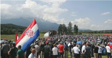  ?? (Reuters) ?? PARTICIPAN­TS TAKE part in a Catholic ceremony commemorat­ing the turning away from Austria of pro-Nazi Croatians at the end of the Second World War.