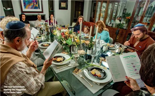  ?? PHOTO: ALAMY ?? The road to freedom: reading the Haggadah at the Seder table
