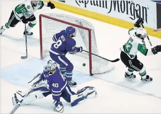  ?? NATHAN DENETTE THE CANADIAN PRESS ?? Texas Stars centre Travis Morin, right, celebrates scoring past Marlies goalie Garret Sparks on Tuesday night.