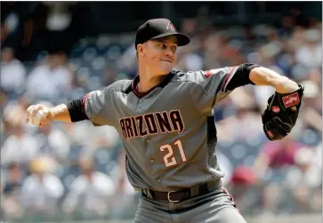  ?? AP PHOTO BY FRANK FRANKLIN II ?? Arizona Diamondbac­ks’ Zack Greinke delivers a pitch during the first inning of a baseball game against the New York Yankees Wednesday, July 31, in New York.