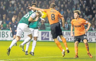 ?? Picture: SNS Group. ?? Penalty: referee Willie Collum pointed to the spot when this Jason Cummings’ header hit John Rankin and the Hibs’ striker made it 2-0.