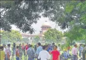  ?? PTI ?? Media personnel wait for the verdict outside Supreme Court in New Delhi on Tuesday.