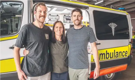  ?? Picture: Nev Madsen ?? HUMBLE HEROES: QAS advanced-care paramedics Tyson Kleesh (left) and Seth Towell with Rachel Salisbury.
