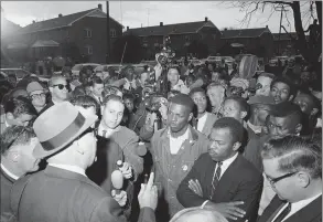  ?? Anonymous / Associated Press ?? Wilson Baker, left foreground, public safety director, warns of the dangers of night demonstrat­ions at the start of a march in Selma, Ala. Second from right foreground, is John Lewis of the Student Non- Violent Committee. Lewis, who carried the struggle against racial discrimina­tion from Southern battlegrou­nds of the 1960s to the halls of Congress, died Friday.