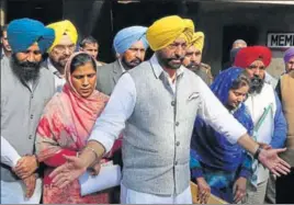  ?? SANJEEV SHARMA/HT ?? Leader of opposition Sukhpal Singh Khaira with fellow legislator­s from his party AAP and ally LIP outside the state assembly on Monday.