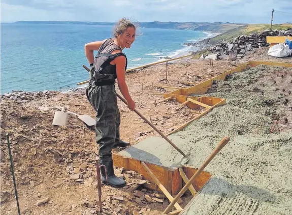  ?? ?? » Above, Christine Coyne gets her hands dirty laying the foundation­s for her new chalet at Tregonhawk­e, on Whitsand Bay, which she is rebuilding, below, on her own. Right, many of the skills she has needed were picked up at the Boat Building Academy and Furniture School in Lyme Regis