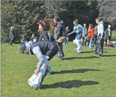  ??  ?? Parents fare slightly better than the young children in the sack race.