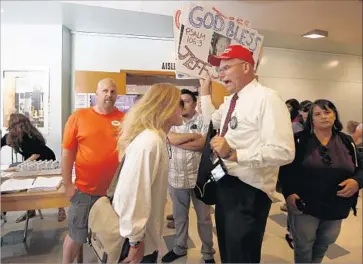  ?? Francine Orr Los Angeles Times ?? LOWELL KURT BROWN, left, of Granada Hills engages in a shouting match with Trump supporter Arthur Schaper after Rep. Brad Sherman’s town hall in Reseda. Trump backers frequently interrupte­d Sherman.