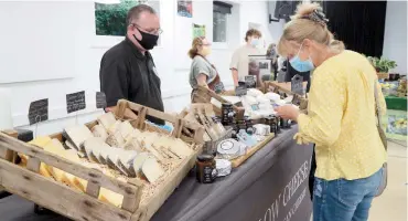  ??  ?? Robert Brownbill of Marlow Cheese at Metre Market in Cookham Dean Village Hall. Photo by Declan Murphy