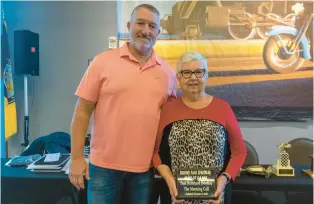  ?? BOB YURKO/SPECIAL TO THE MORNING CALL ?? The late Paul Reinhard, a longtime Morning Call sports writer and editor, recently was inducted into the Dorney Park Speedway/Mahoning Valley Speedway Hall of Fame. His son, Mike, and widow, Betty, accepted the award.
