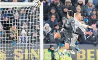  ?? FRANK AUGSTEIN/THE ASSOCIATED PRESS ?? Chelsea’s Pedro scores his side’s second goal during an FA Cup quarterfin­al match against Leicester City on Sunday.