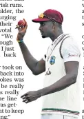  ??  ?? Setting the tone: Jason Holder dismisses Jos Buttler (above) on his way to Test best figures of six for 42 (below)