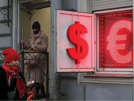  ?? EPA ?? A money exchange office in the Russian city of St Petersburg displays US dollar and euro signs