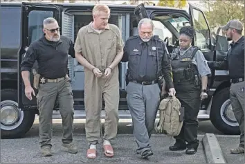  ?? Joshua Boucher Pool Photo ?? ALEX MURDAUGH is led to court in Walterboro, S.C., for his sentencing Friday in the 2021 shooting deaths of his wife and son. The case inspired podcasts and documentar­ies in addition to daily media coverage.