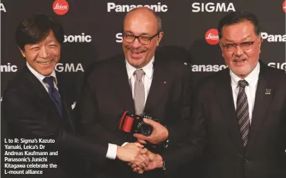  ??  ?? L to R: Sigma’s Kazuto Yamaki, Leica’s Dr Andreas Kaufmann and Panasonic’s Junichi Kitagawa celebrate the L-mount alliance